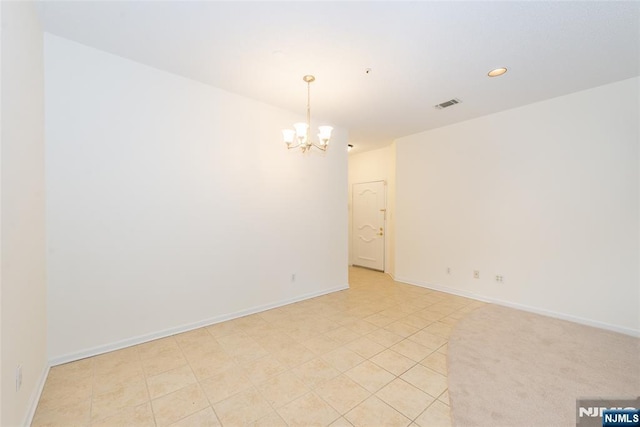 unfurnished room with baseboards, an inviting chandelier, recessed lighting, light tile patterned floors, and visible vents