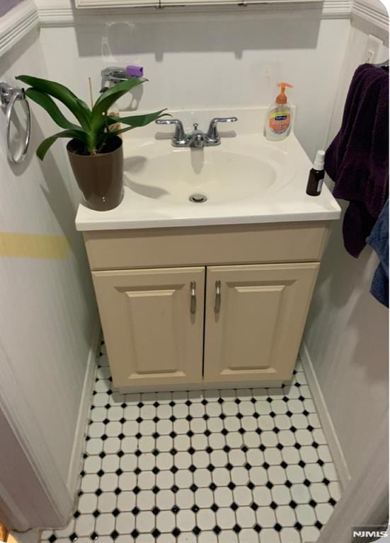 bathroom featuring baseboards and vanity