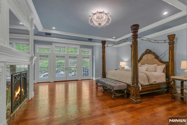 22 Nottingham Ct, Ringwood, NJ 07456 - bedroom featuring hardwood / wood-style floors, access to exterior, a high end fireplace, ornamental molding, and a raised ceiling