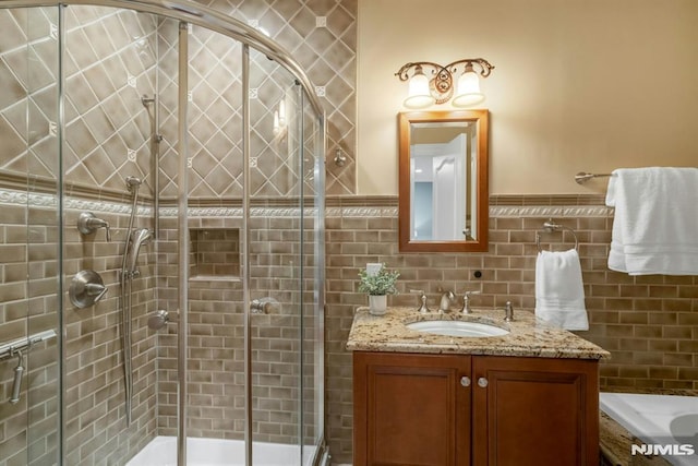 22 Nottingham Ct, Ringwood, NJ 07456 - bathroom with a stall shower, vanity, tile walls, and a wainscoted wall
