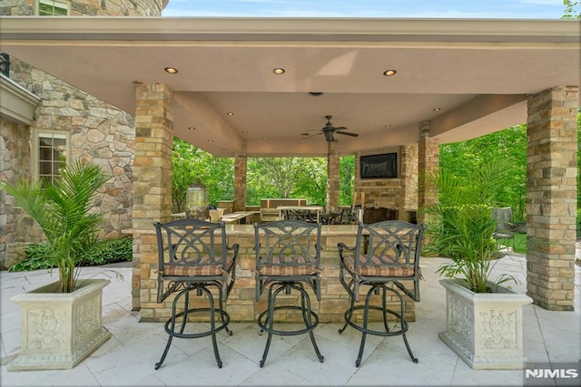 22 Nottingham Ct, Ringwood, NJ 07456 - view of patio featuring an outdoor stone fireplace, a ceiling fan, and outdoor dining area