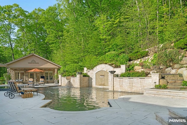 22 Nottingham Ct, Ringwood, NJ 07456 - view of community featuring a storage structure, a patio, an outbuilding, and a pool