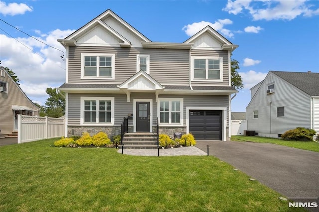 133 Graham Ter, Saddle Brook, NJ 07663 - view of front of property featuring board and batten siding, asphalt driveway, an attached garage, and stone siding