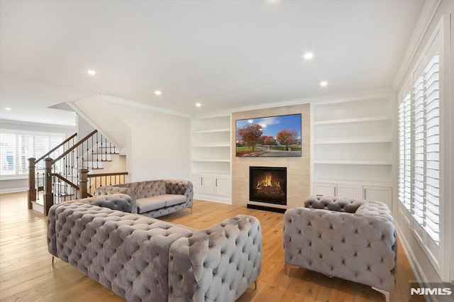 133 Graham Ter, Saddle Brook, NJ 07663 - living room featuring light wood-style flooring, healthy amount of natural light, a large fireplace, stairway, and recessed lighting