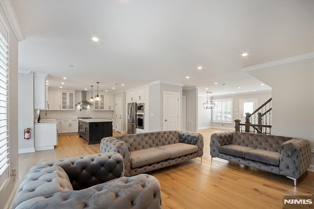 133 Graham Ter, Saddle Brook, NJ 07663 - living area with ornamental molding, light wood-style floors, recessed lighting, and stairs