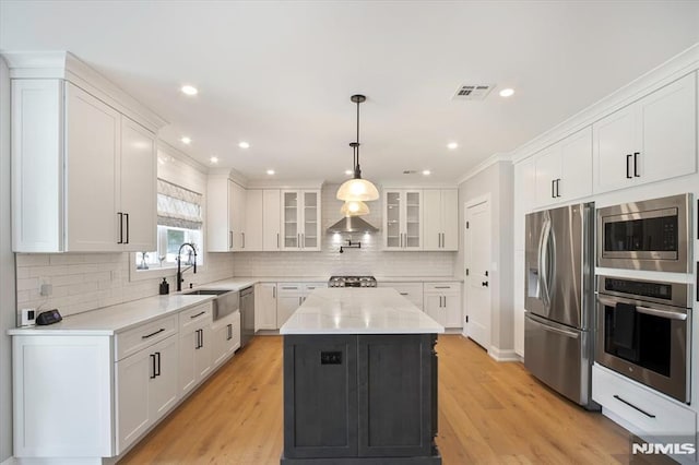 133 Graham Ter, Saddle Brook, NJ 07663 - kitchen featuring stainless steel appliances, glass insert cabinets, white cabinetry, light countertops, and recessed lighting