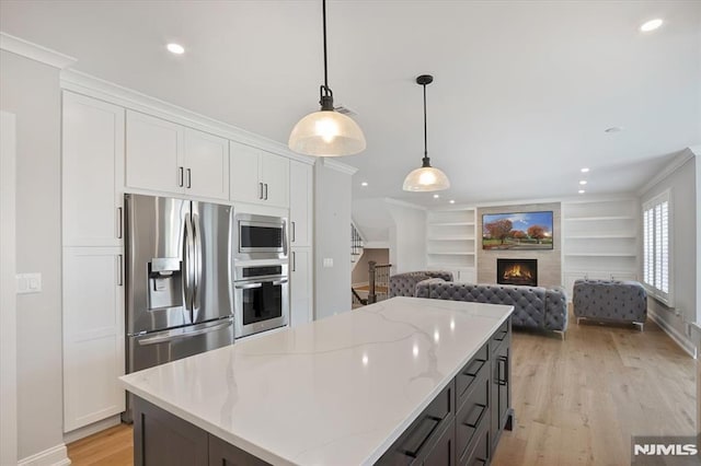 133 Graham Ter, Saddle Brook, NJ 07663 - kitchen featuring stainless steel appliances, light wood finished floors, white cabinetry, a center island, and recessed lighting