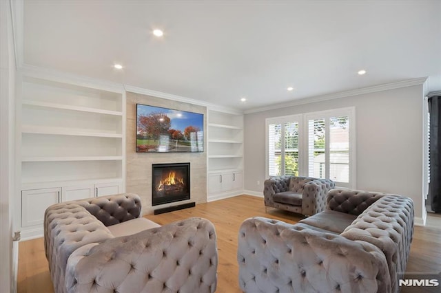 133 Graham Ter, Saddle Brook, NJ 07663 - living room with built in shelves, crown molding, a fireplace, light wood finished floors, and recessed lighting