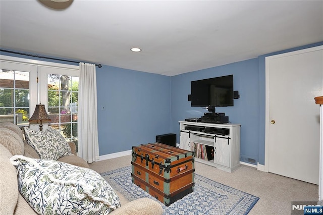 living area featuring baseboards, carpet flooring, and recessed lighting