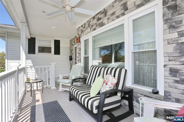 view of patio with a porch and ceiling fan