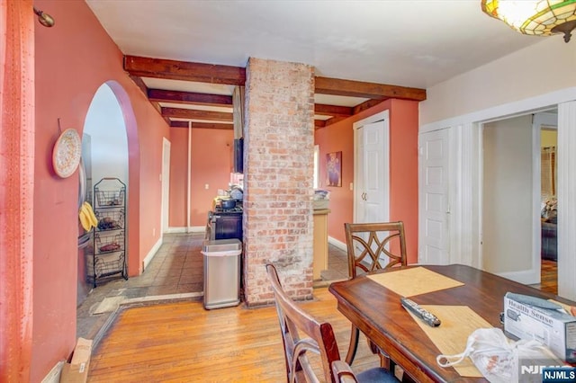 27 Donaldson Ave, Rutherford, NJ 07070 - dining room featuring arched walkways, light wood-style flooring, and beam ceiling