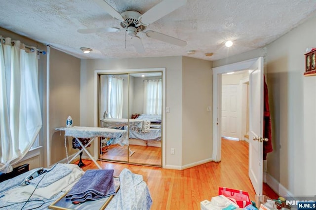 27 Donaldson Ave, Rutherford, NJ 07070 - bedroom with wood finished floors, multiple windows, a textured ceiling, and a closet