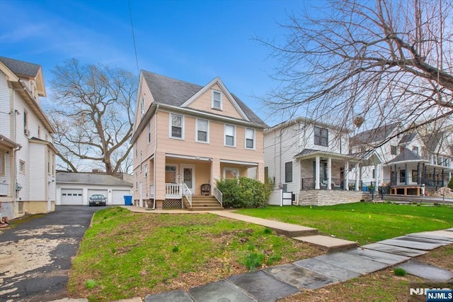 27 Donaldson Ave, Rutherford, NJ 07070 - traditional style home with a front lawn, a porch, an outdoor structure, and a garage