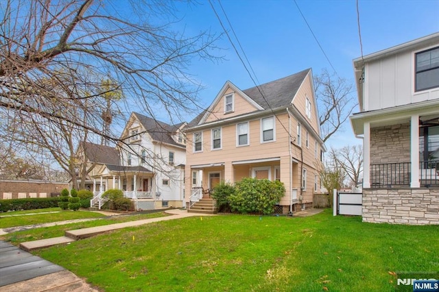 27 Donaldson Ave, Rutherford, NJ 07070 - american foursquare style home featuring a front lawn