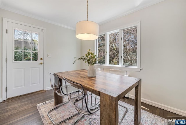 dining room featuring baseboards, ornamental molding, and dark wood-style floors