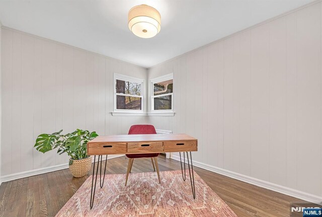 home office with baseboards and wood finished floors