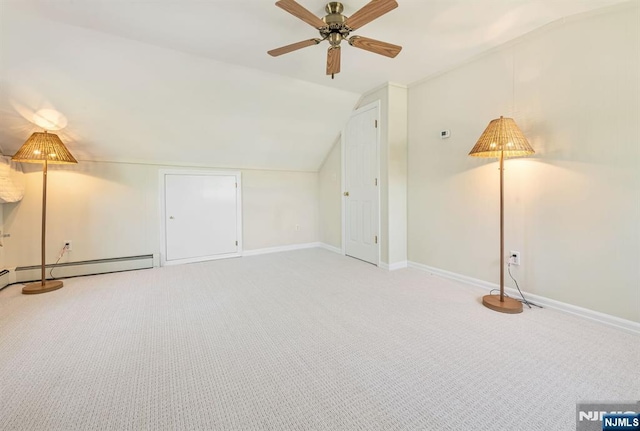 additional living space with lofted ceiling, a ceiling fan, carpet floors, and baseboards