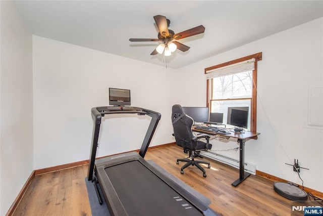 home office featuring wood finished floors, baseboards, and ceiling fan