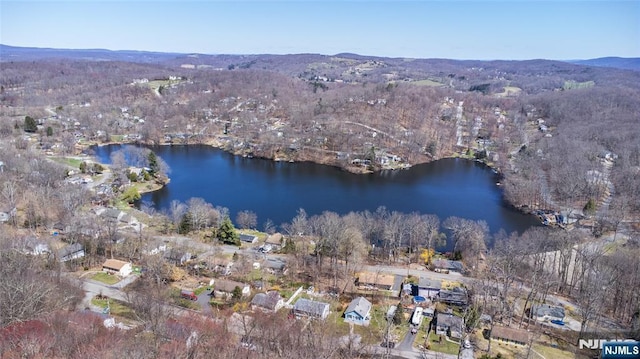 aerial view featuring a water and mountain view
