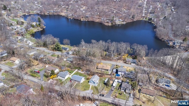 birds eye view of property featuring a water view and a residential view