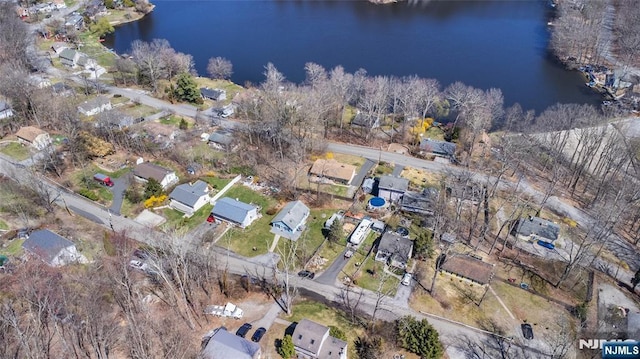 aerial view with a residential view and a water view