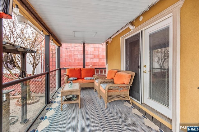 sunroom / solarium with an outdoor living space