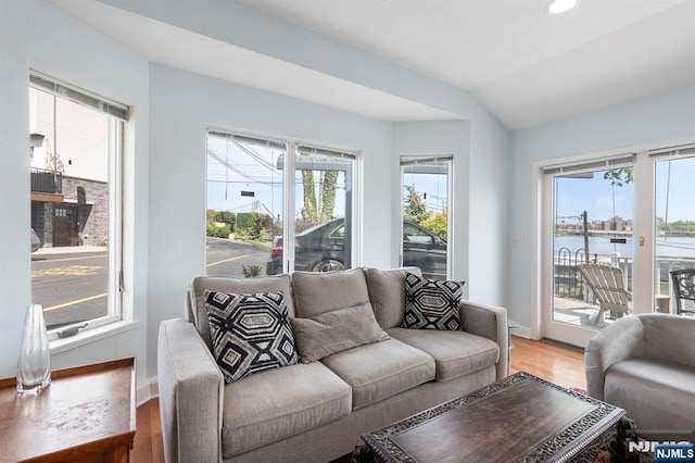 4 Colony Rd, Edgewater, NJ 07020 - living room with a water view, light wood-type flooring, baseboards, vaulted ceiling, and recessed lighting