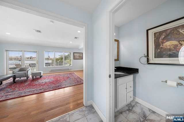 4 Colony Rd, Edgewater, NJ 07020 - bathroom with baseboards, a water view, vanity, and visible vents