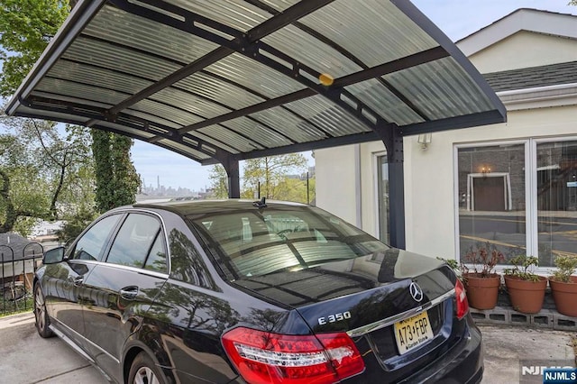 4 Colony Rd, Edgewater, NJ 07020 - view of parking / parking lot featuring a carport