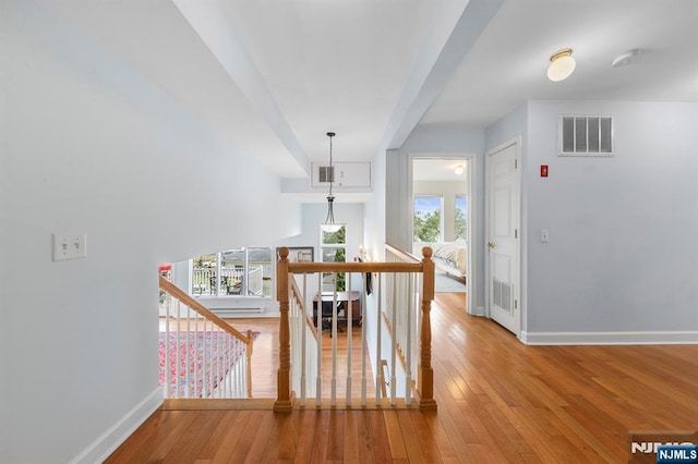 4 Colony Rd, Edgewater, NJ 07020 - hallway featuring hardwood / wood-style floors, an upstairs landing, and visible vents