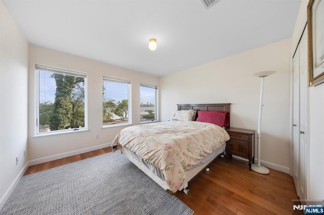 4 Colony Rd, Edgewater, NJ 07020 - bedroom featuring wood finished floors, baseboards, and multiple windows