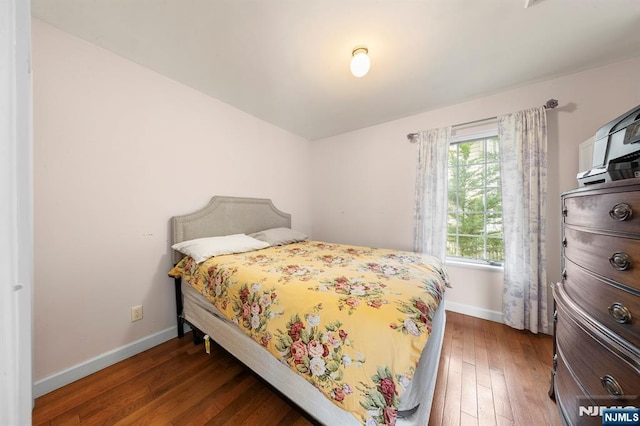 4 Colony Rd, Edgewater, NJ 07020 - bedroom featuring baseboards and dark wood-style flooring
