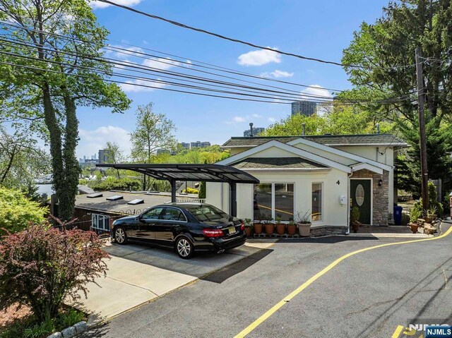 4 Colony Rd, Edgewater, NJ 07020 - view of car parking featuring driveway and a carport