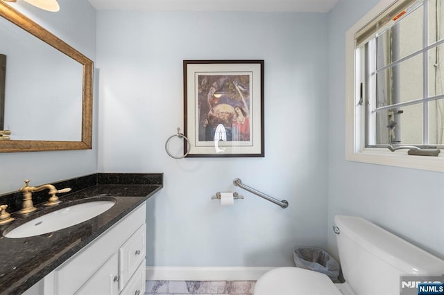 4 Colony Rd, Edgewater, NJ 07020 - bathroom with vanity, toilet, and baseboards