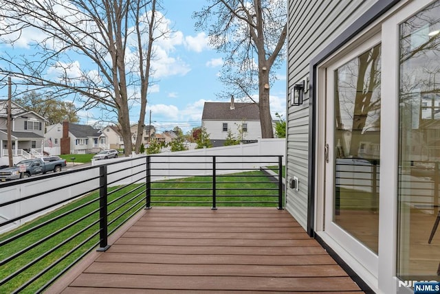 wooden deck with a residential view
