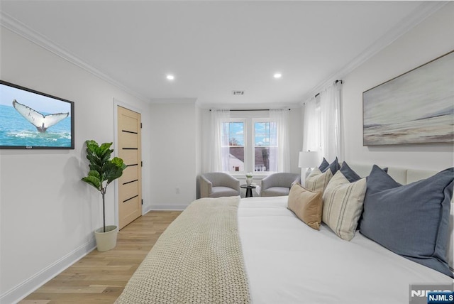 bedroom with recessed lighting, light wood-style floors, baseboards, and ornamental molding
