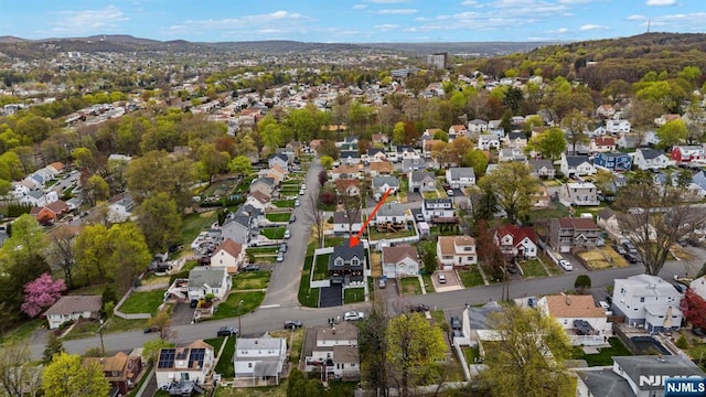 drone / aerial view with a mountain view and a residential view