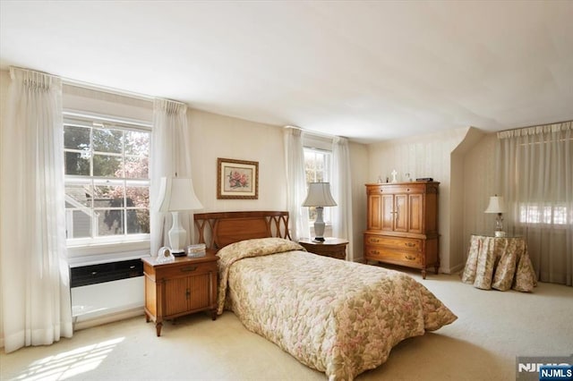 bedroom with light colored carpet