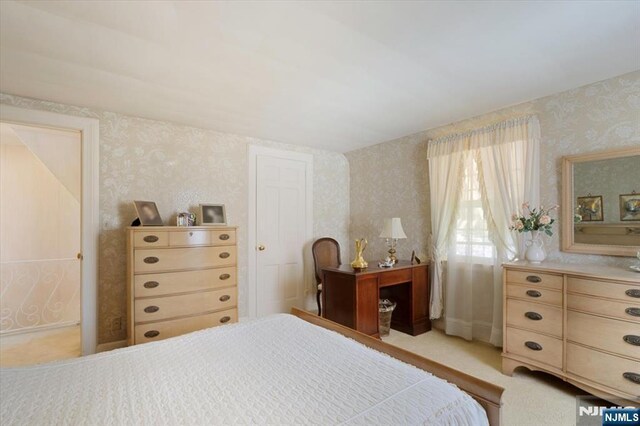 bedroom featuring wallpapered walls