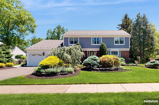 19 Merrill Dr, Mahwah, NJ 07430 - view of front facade with an attached garage, a front lawn, driveway, and brick siding