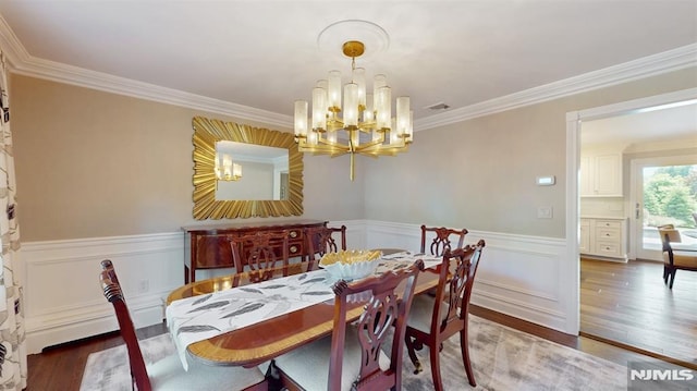 19 Merrill Dr, Mahwah, NJ 07430 - dining area with a chandelier, wood finished floors, ornamental molding, and a wainscoted wall