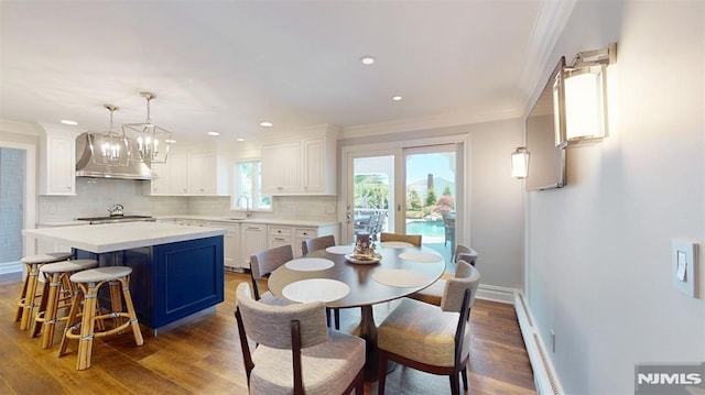 19 Merrill Dr, Mahwah, NJ 07430 - dining area featuring ornamental molding, a baseboard radiator, wood finished floors, baseboards, and recessed lighting