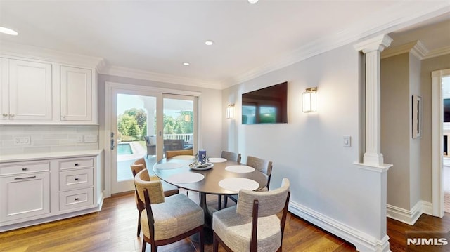 19 Merrill Dr, Mahwah, NJ 07430 - dining area featuring decorative columns, ornamental molding, wood finished floors, recessed lighting, and baseboards