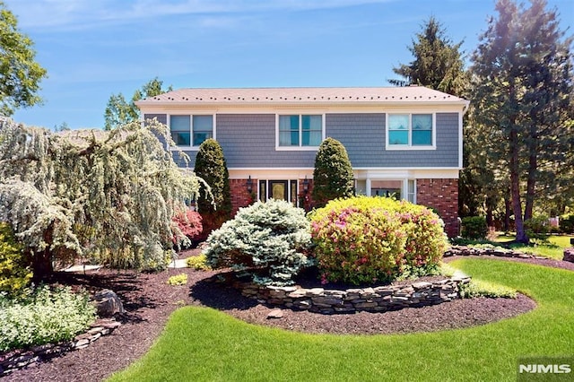 19 Merrill Dr, Mahwah, NJ 07430 - view of front of house with brick siding and a front lawn