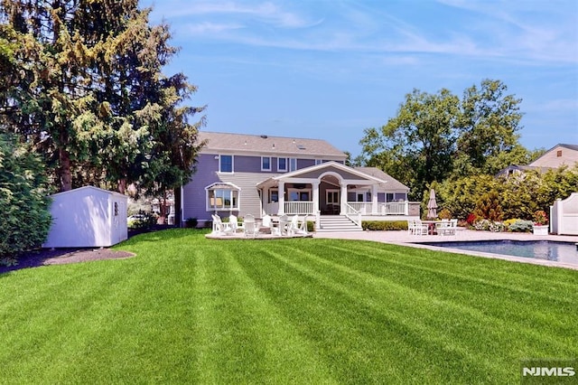 19 Merrill Dr, Mahwah, NJ 07430 - rear view of house with a patio area, a yard, an outdoor pool, and covered porch