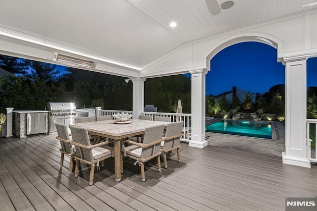 19 Merrill Dr, Mahwah, NJ 07430 - deck at night with outdoor dining space and an outdoor pool
