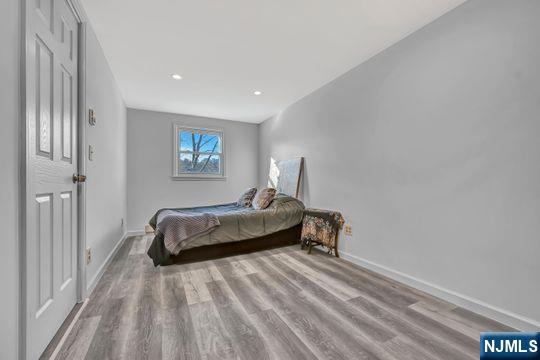 14 Harvey Rd, West Milford, NJ 07421 - bedroom featuring baseboards, wood finished floors, and recessed lighting