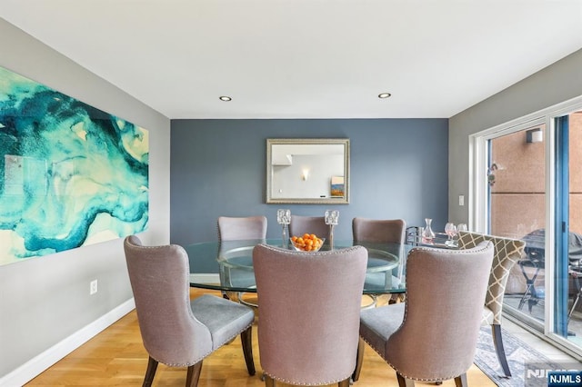 dining area with baseboards, recessed lighting, and wood finished floors