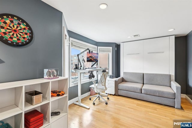 office space featuring light wood-type flooring, recessed lighting, and visible vents