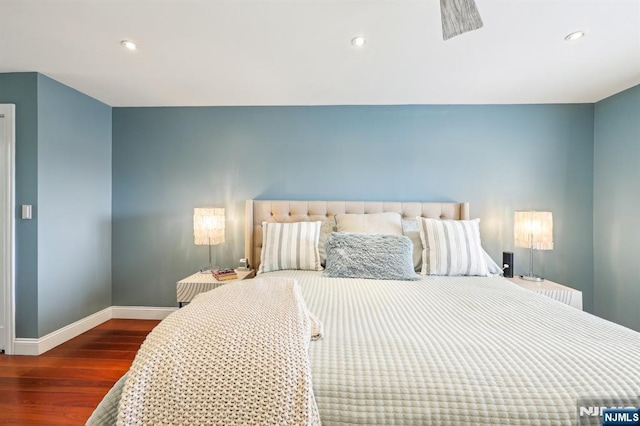 bedroom with baseboards, recessed lighting, and wood finished floors